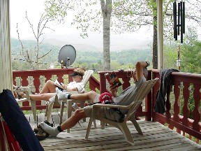Judy and Charlie on the deck of their mountain cabin.  April, 2006.