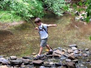 SeanCrossingCreek09071001 Sean crossing a creek on rocks instead of using the bridge. July 10, 2009.