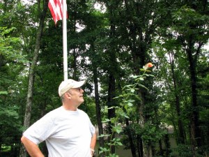 George looking up at About Face rose, Fairfield Glade, Tennessee.  August 27, 2009.