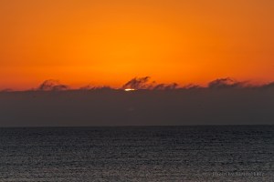 The sun making an appearance off Ocean Isle Beach.  December 14, 2012.
