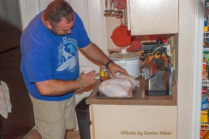 Bob injecting Cajun marinade into turkey breasts, Palm Harbor, Florida.  November 28, 2013.
